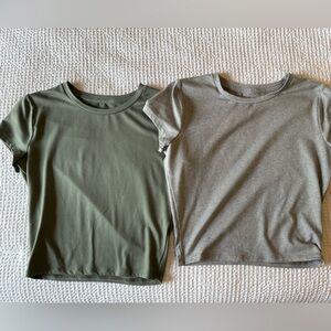 Two tight fotting cropped shirts